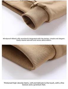 Detail of khaki jacket showing windproof ribbed cuffs and thick twill fabric texture