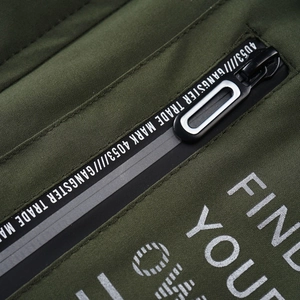 Detail of army green jacket with waterproof zipper and GANGSTER TRADE MARK screen printing