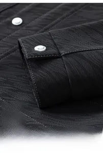 Detailed close-up of dark grey cargo jacket cuff with matte silver metal buttons