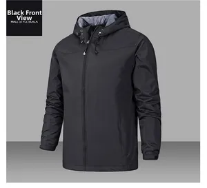 Detail view of black windproof outdoor jacket showing velcro cuffs and hood design