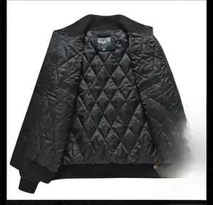 Detail of men's bomber jacket featuring diamond quilted lining and ribbed knit cuffs