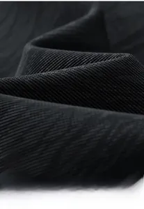 Macro shot of high-quality dark grey textured fabric with twill weave for men's jackets