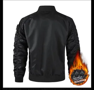 Detail view of black bomber jacket featuring diamond-quilted lining and ribbed cuffs