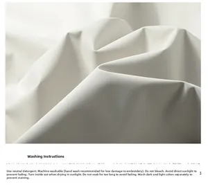 Detailed washing instruction tag on white waterproof fabric of the hooded jacket