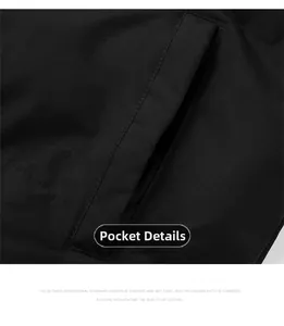 Macro shot of side pocket stitching and high-density fabric on black winter puffer jacket