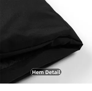 Detailed close-up of the black puffer jacket hem showing high-quality stitching and texture