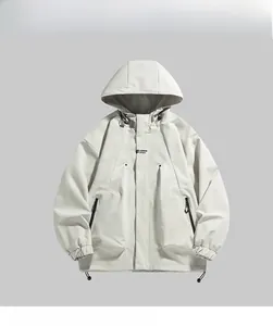 Detail of windproof light gray jacket showing hood drawstrings and zip pockets