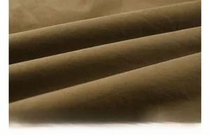 Close-up detail of warm brown fleece lining showing thick, soft and cozy fabric texture