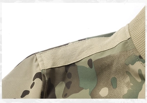 Detailed macro view of multicam pilot jacket shoulder with durable ribbed cuffs