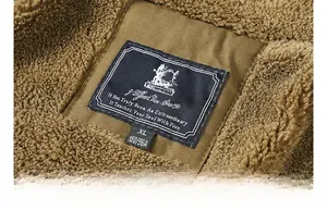 Macro view of brown sherpa lining texture and woven brand neck label with size tag
