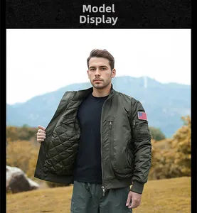 Detail of army green pilot jacket featuring diamond quilted lining and flag patch on arm