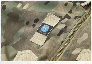 Close-up of military jacket metal zipper and Special Forces badge on camo fabric