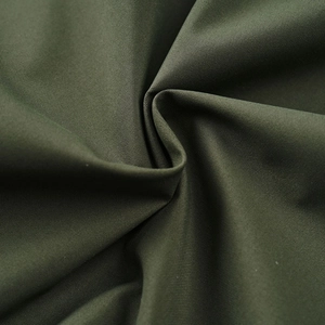 Macro texture of olive green woven fabric for durable men outdoor sports jacket
