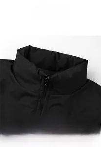 Detail view of the stand-up collar and high-quality zipper on this black winter jacket