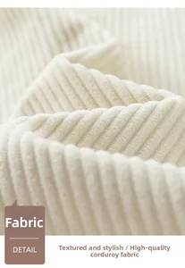 Macro shot of high-quality thick corduroy fabric showing soft texture and striped pattern