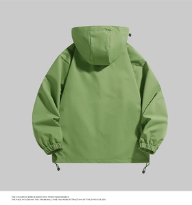 Detail view of grass green hooded windbreaker jacket with adjustable hem drawstrings