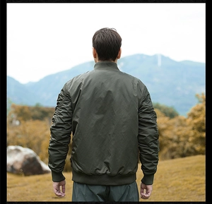 Detailed back view of military green bomber jacket featuring rib-knit collar and sleeve pleats