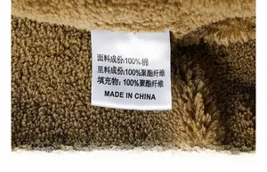 Detailed macro view of the 100% cotton fabric and polyester lining on winter jacket