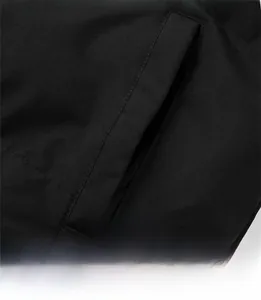 Close-up of side pocket detail on a black padded winter jacket with 3D tailored fit