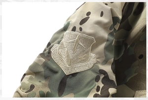 Close-up of military MA1 flight jacket sleeve with camouflage pattern and US Army badge