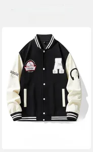 Detail of the high-quality embroidered badges and white snap buttons on baseball jacket
