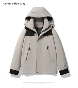 Detail of outdoor jacket showing beige grey and black panels with hooded collar and zipper