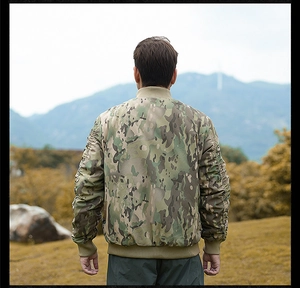 Rear view of a camouflage bomber jacket featuring ribbed cuffs and a classic military design