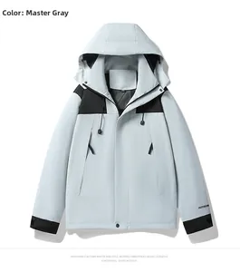 Detail view of the windproof outdoor jacket featuring a slate grey and black panel design