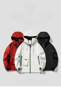 Close-up of lightweight windproof outdoor jackets with adjustable hoods and velcro cuffs