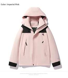 Detail of pink and black outdoor jacket showing zipper pockets and OUTDOOR embroidery