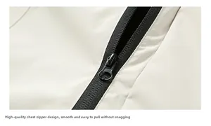 Close-up of durable black zipper on off-white windbreaker jacket with fine fabric texture