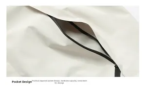 Detail view of functional zipper pocket design on beige windbreaker sports jacket