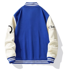 Detail view of the back of a blue and white varsity jacket with sleeve embroidery