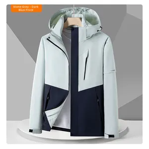 Outdoor hooded jacket in gravel grey and navy blue patchwork with zipper and pockets