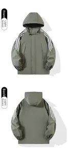 Front and back views of a light green waterproof outdoor jacket with white triple stripes