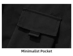Close-up detail of a minimalist small pocket on black outdoor hiking jacket fabric