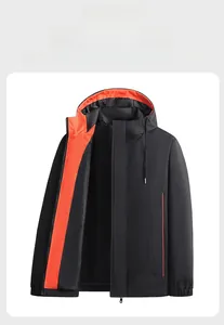 Detail of hooded windproof jacket with contrast orange lining and adjustable drawstring