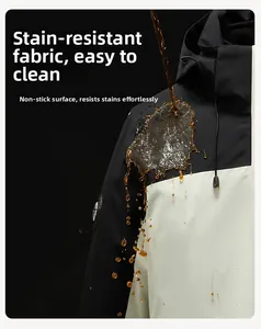 Close-up of waterproof and dirt-resistant fabric on black and white hooded outdoor jacket