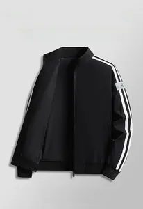 Detailed view of the black jacket's ribbed cuff and sleeve with white stripe accents
