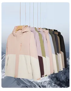 Detail view of colorful waterproof outdoor jackets with adjustable hoods and zip pockets