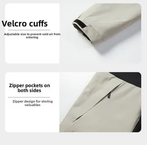 Detail of adjustable velcro cuffs and secure zippered pockets on gray outdoor jacket