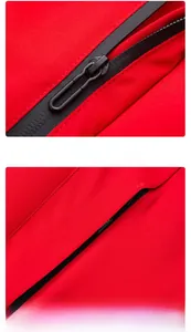 Detail of red waterproof jacket featuring black sealed zipper and hidden side pocket