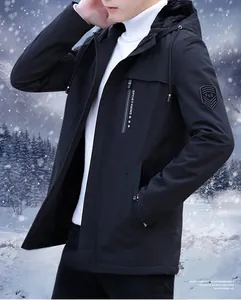 Detail of windproof men's winter hooded jacket with fleece lining and shield badge on arm