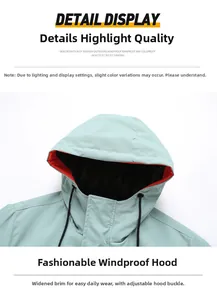 Detail of adjustable windproof hood with contrast orange lining and black drawstrings