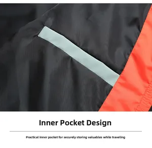 Detail of the inner storage pocket on a black jacket lining with orange contrast