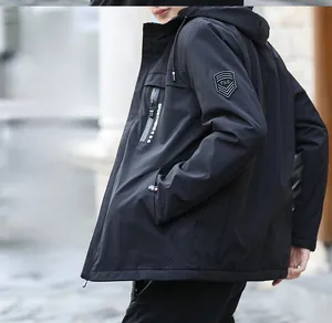 Detail of hooded jacket featuring a shield arm patch and sport zipper pockets