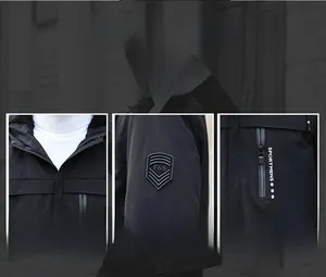 Detail view of hooded stand collar, sleeve badge and waterproof zipper on black jacket