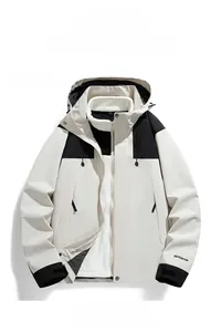 Detail of 3-in-1 ivory white outdoor jacket with detachable fleece lining and velcro cuffs