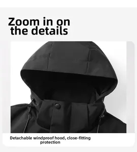 Detail view of a waterproof black outdoor jacket with detachable hood and adjustable drawstring