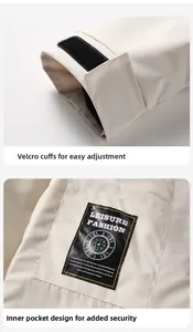 Detail view of adjustable velcro cuffs and inner pocket of a white outdoor jacket